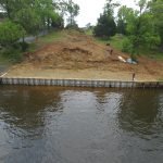 Now that the seawall is complete we have a lot fo dirt work to do up the hill.