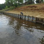 Navy style seawall is complete and backfilled.