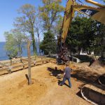 The excavator and its vibratory hammer exert downward forces on the piling in excess of 76,000 lbs.