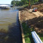 As you can see my neighbor's seawall still has a lean to it. The seawall pilings are so short that standing it up any more could cause damage. As a courtesy we installed tieback reinforcements on two of her pilings. Protection for my seawall and a freebie for her.