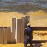 Installing the vinyl seawall at Toledo Bend