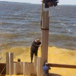 Installing the vinyl seawall at Toledo Bend
