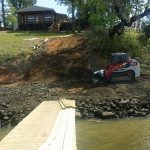 My neighbor installing rip rap on his seawall on April 3, 2018