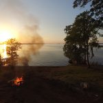 Toledo Bend sunset with campfire in the foreground