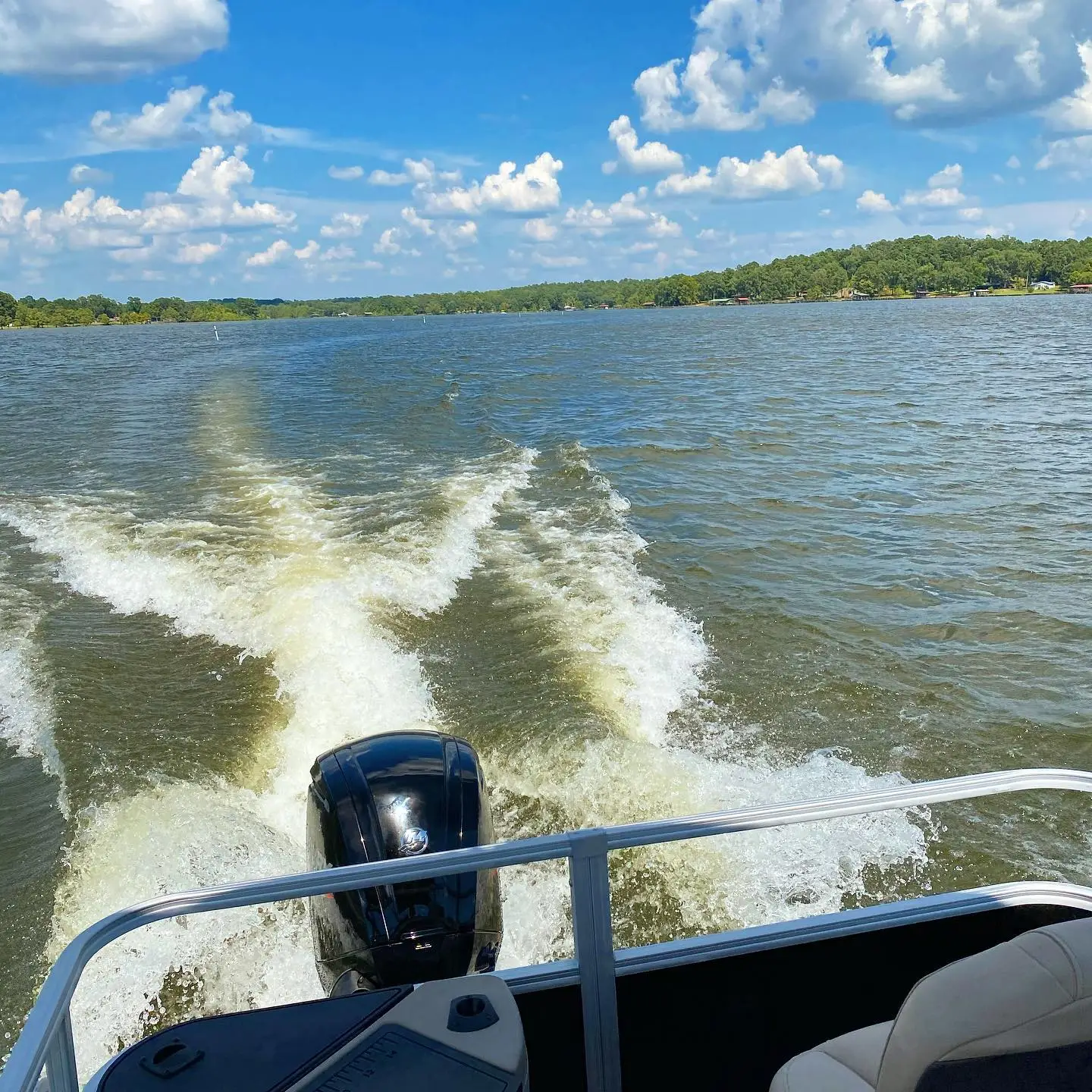 On the pontoon-Making waves and catching rays. The lake is open and ready! #pontoonboat #catchingwaves #ridingboats #lakefun
