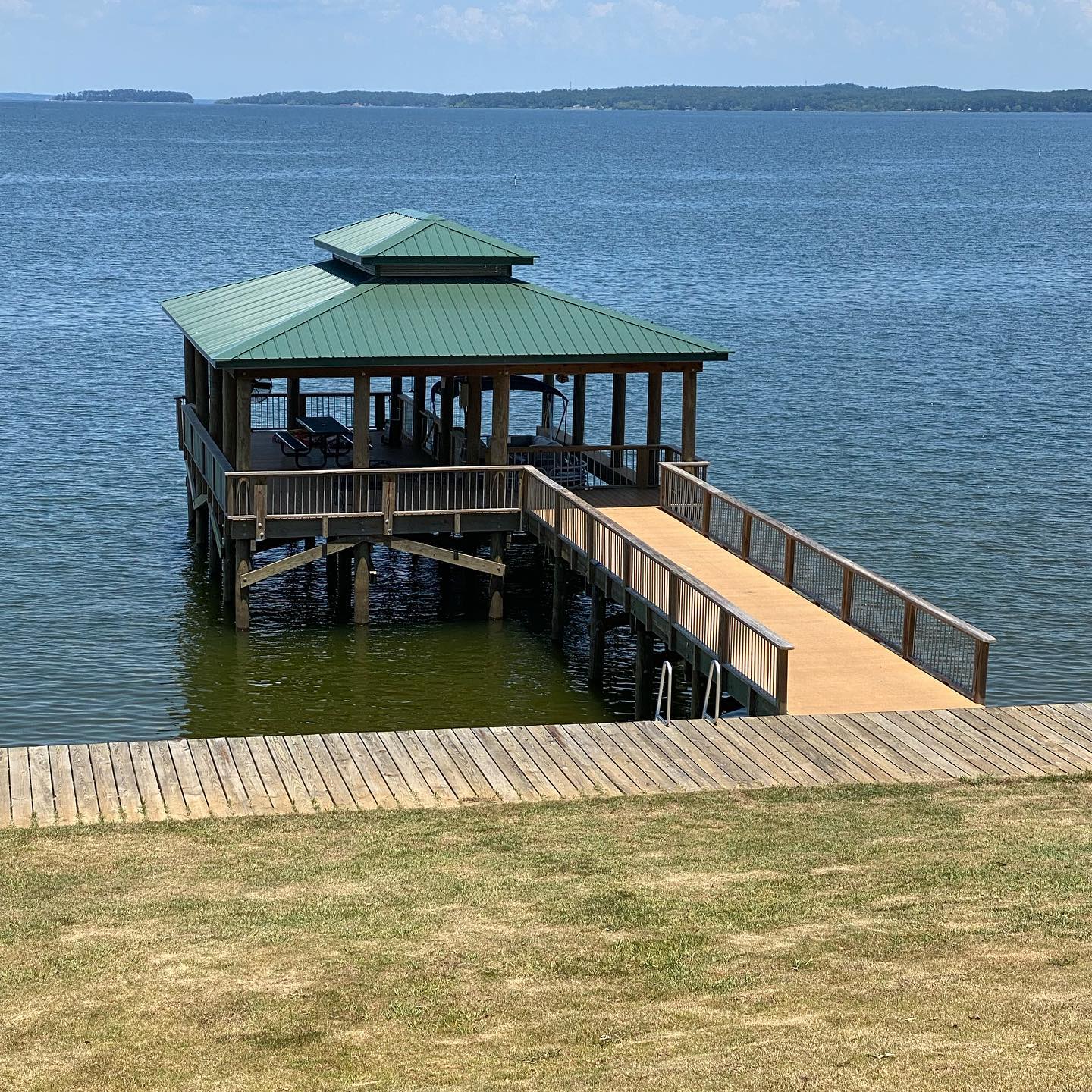 Nice calm lake in the morning - come soak up the sun or enjoy the shade under our nice boat house. #summerdays #lakehouse #boathouse #calmlake