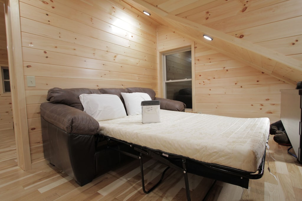 Sleeper sofa folds out into a queen size bed.