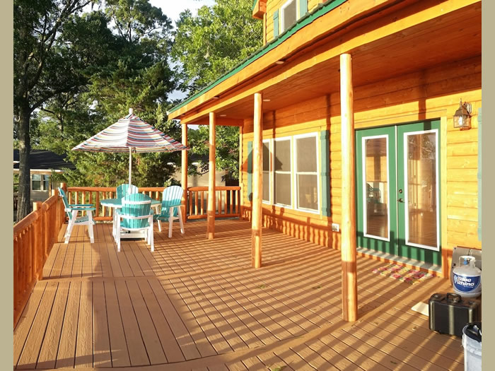 The huge deck facing the lake is made of trex. No splinters in your feet!