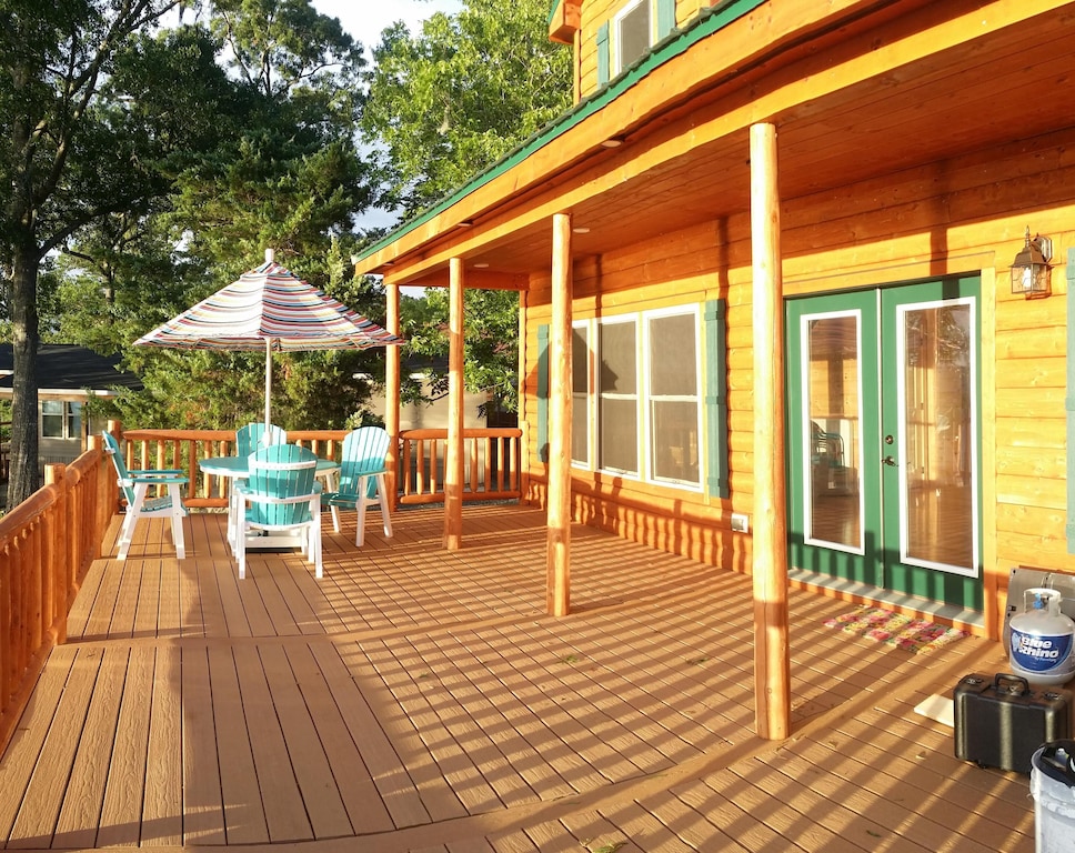 The huge deck facing the lake is made of trex. No splinters in your feet!