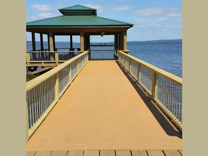 Boathouse with boat lift and gathering area.