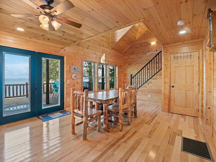 Dining room area with lots of windows showing the lake.
